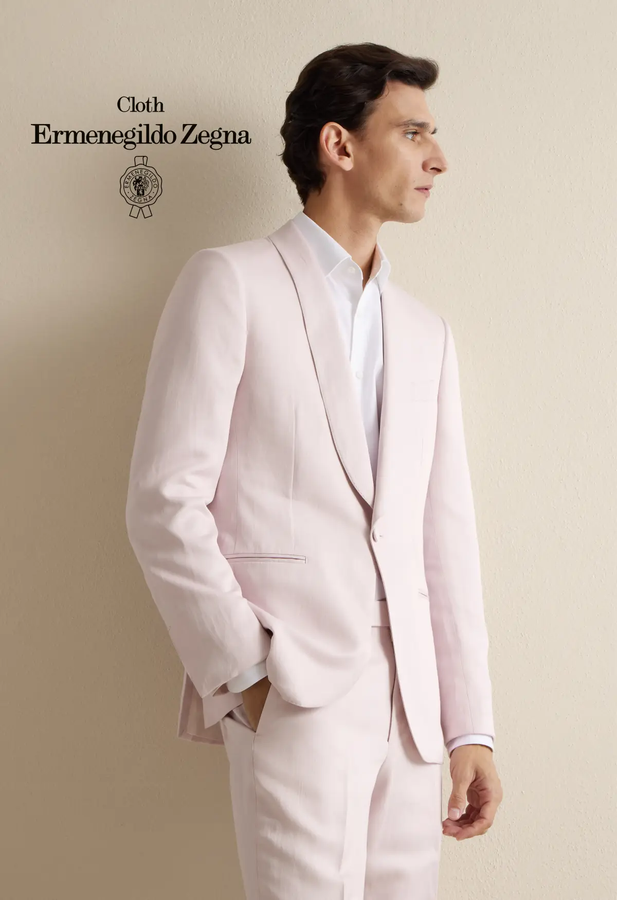 Blush-pink single-button suit with a shawl lapel over a crisp white dress shirt—elegant summer tailoring